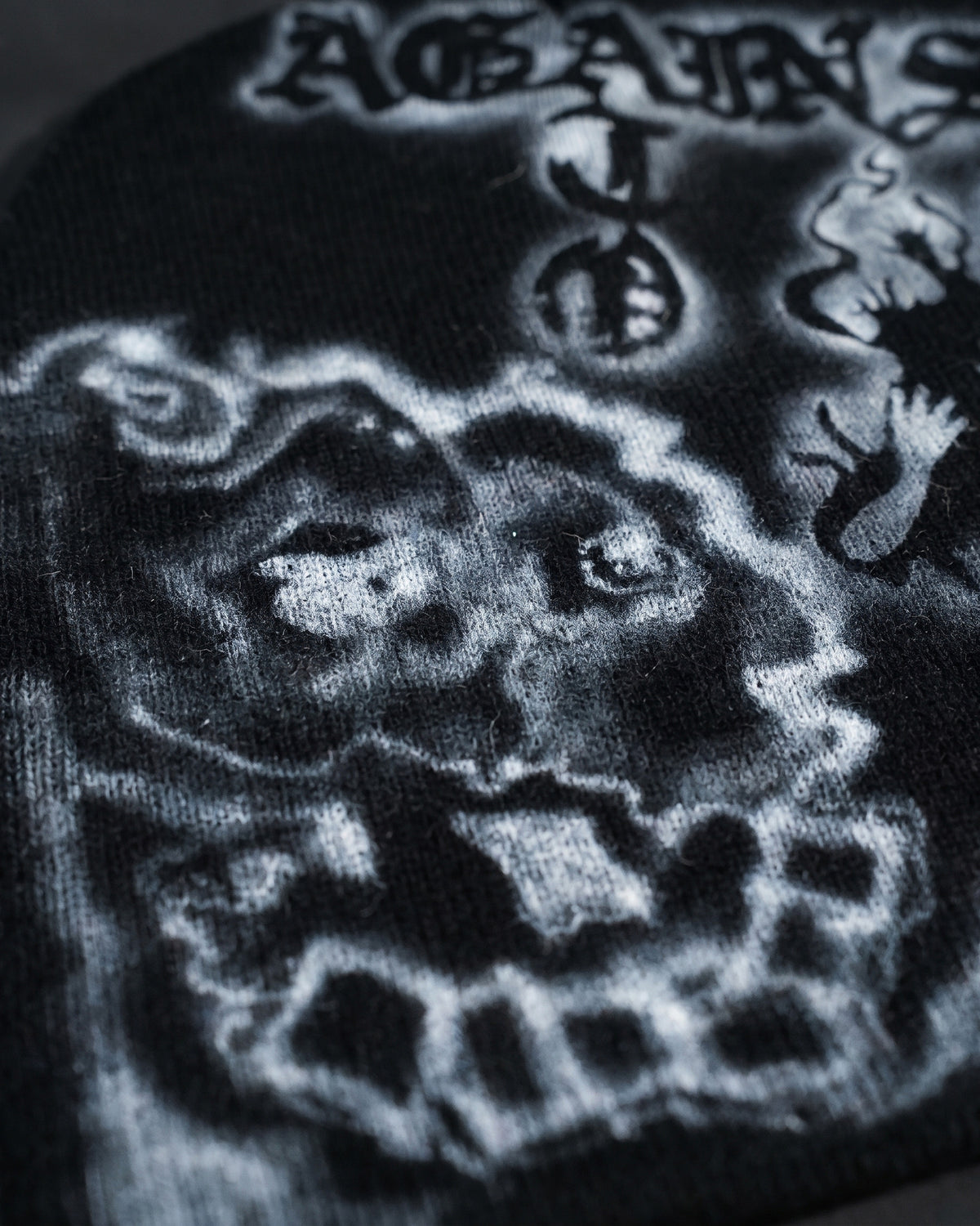 ATO AIRBRUSH Black Skeleton Beanie – close-up of the airbrushed skull on black knit