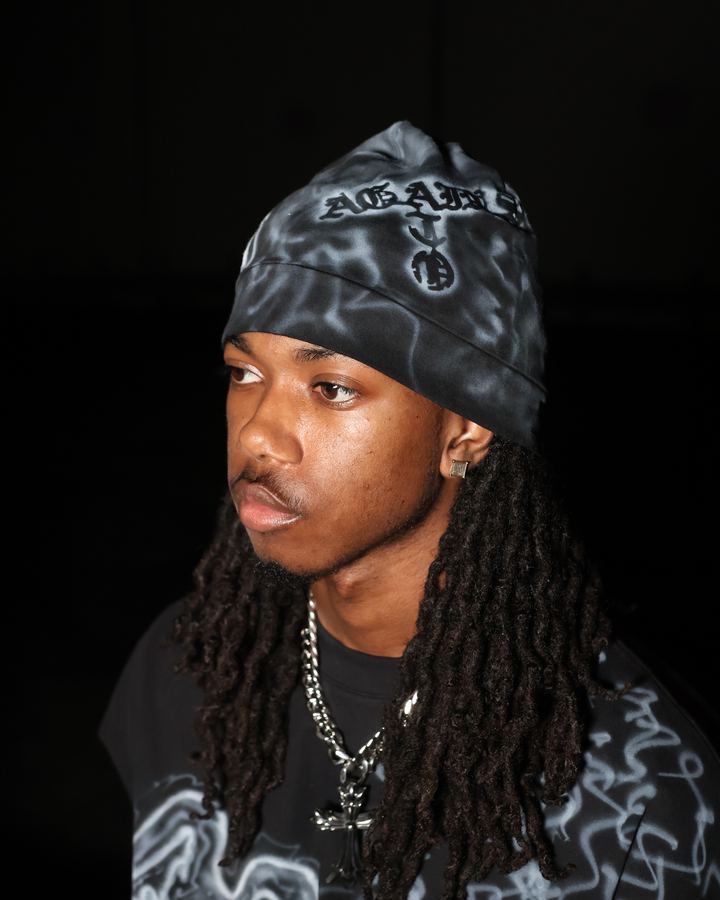 Distressed knit beanies with custom airbrush artwork. Free with any piece.